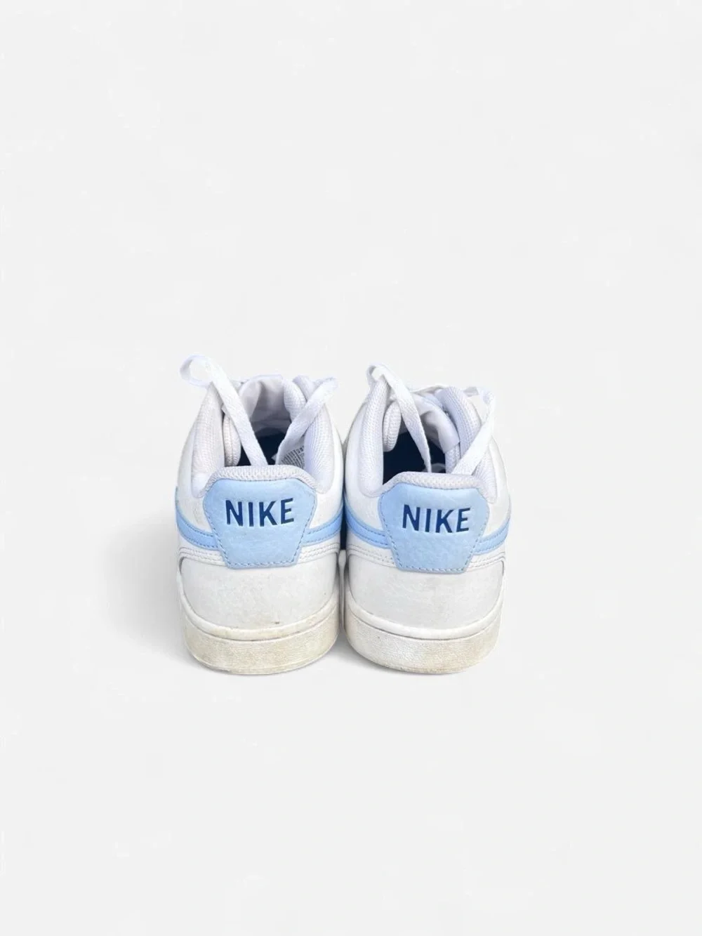 Nike Women’s Court Low-Top Leather Sneakers in White with Light Blue Swoosh